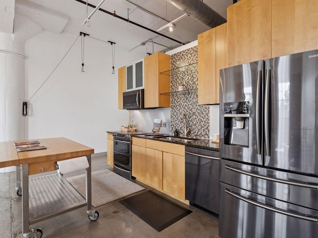 730 Stinson Blvd Unit 106, Minneapolis, MN 55413 - kitchen with stainless steel appliances, finished concrete floors, backsplash, light brown cabinets, and track lighting