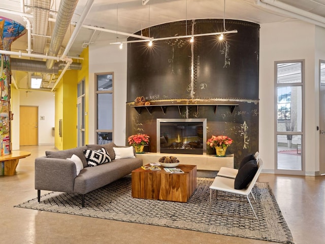 730 Stinson Blvd Unit 106, Minneapolis, MN 55413 - living room featuring finished concrete flooring and a fireplace