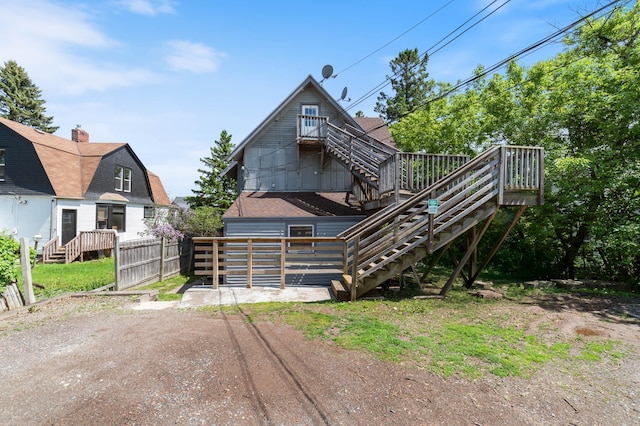 1511 4th St, Duluth, MN 55812 - view of front of house featuring stairs, a wooden deck, and roof with shingles