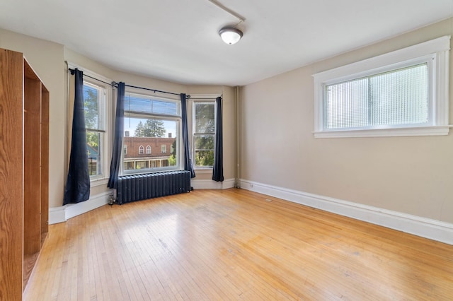 1511 4th St, Duluth, MN 55812 - unfurnished room featuring radiator, baseboards, and wood-type flooring