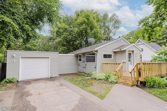 1019 3rd Ave N, Moorhead, MN 56560 - view of front of house with a wooden deck and driveway