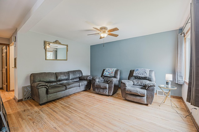 1019 3rd Ave N, Moorhead, MN 56560 - living area featuring a ceiling fan, light wood-style flooring, and healthy amount of natural light