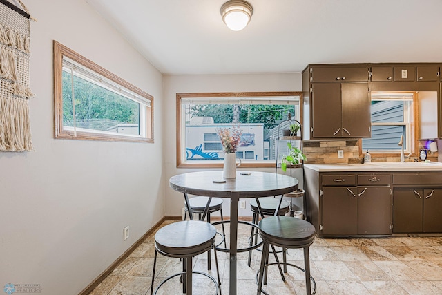1019 3rd Ave N, Moorhead, MN 56560 - dining space with baseboards and light stone finish floors
