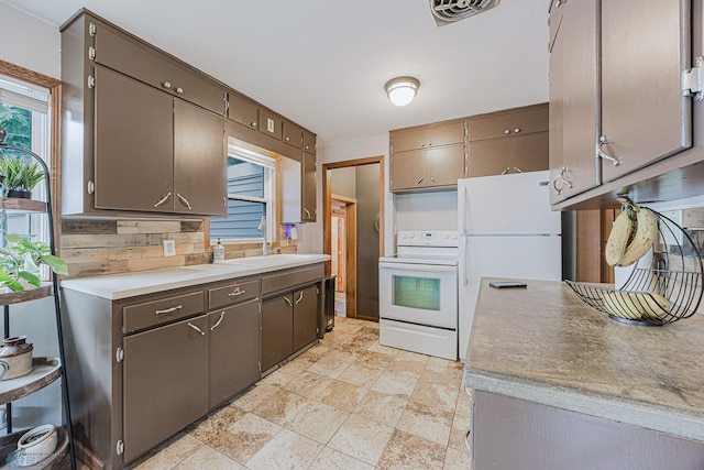 1019 3rd Ave N, Moorhead, MN 56560 - kitchen featuring white appliances and light countertops
