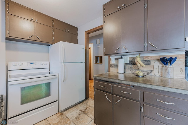 1019 3rd Ave N, Moorhead, MN 56560 - kitchen featuring white appliances and dark brown cabinetry