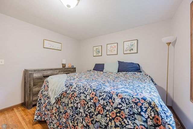 1019 3rd Ave N, Moorhead, MN 56560 - bedroom with wood finished floors and baseboards