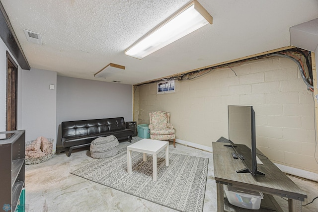 1019 3rd Ave N, Moorhead, MN 56560 - living area with concrete flooring and a textured ceiling