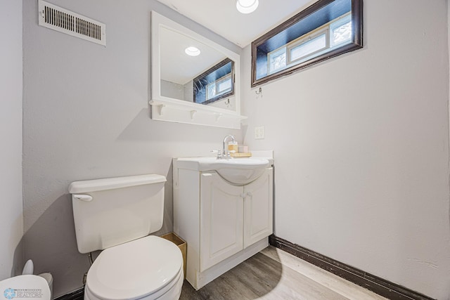 1019 3rd Ave N, Moorhead, MN 56560 - half bathroom featuring vanity and wood finished floors