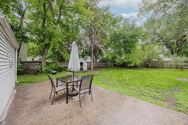 1019 3rd Ave N, Moorhead, MN 56560 - fenced backyard featuring a shed, a patio, and outdoor dining area