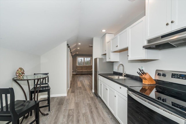 1753 Old N Shore Rd, Duluth Twp, MN 55804 - kitchen with stainless steel electric range, under cabinet range hood, lofted ceiling, dark countertops, and light wood finished floors