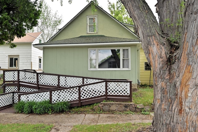 409 3rd St, Bovey, MN 55709 - rear view of house featuring a shingled roof