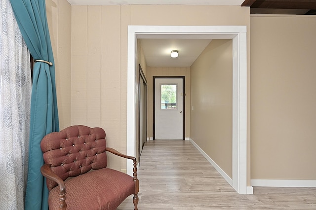 409 3rd St, Bovey, MN 55709 - corridor featuring light wood-type flooring and baseboards