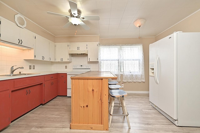 409 3rd St, Bovey, MN 55709 - kitchen featuring white appliances, ceiling fan, a sink, tasteful backsplash, and ornamental molding