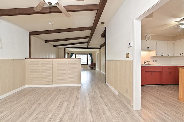 409 3rd St, Bovey, MN 55709 - kitchen with a ceiling fan, open floor plan, light wood-style flooring, beamed ceiling, and a sink