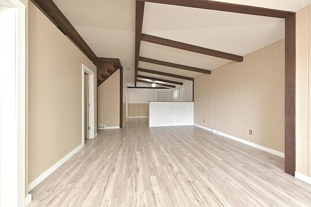 409 3rd St, Bovey, MN 55709 - unfurnished living room with light wood finished floors, ceiling fan, and baseboards