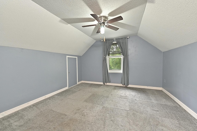 409 3rd St, Bovey, MN 55709 - additional living space featuring a textured ceiling, lofted ceiling, ceiling fan, baseboards, and carpet flooring