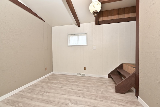 409 3rd St, Bovey, MN 55709 - below grade area featuring wood finished floors