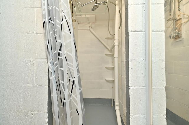 409 3rd St, Bovey, MN 55709 - bathroom featuring a shower with shower curtain