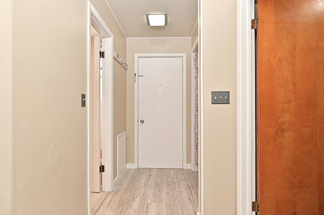 409 3rd St, Bovey, MN 55709 - hallway with light wood-style flooring and baseboards