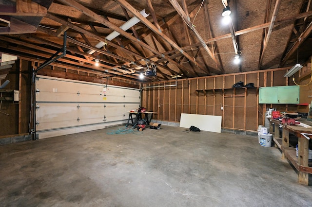 409 3rd St, Bovey, MN 55709 - garage featuring a garage door opener
