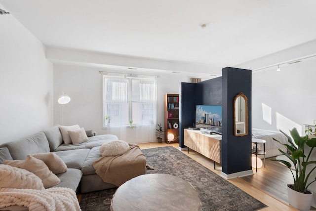 445 Wacouta St Unit 403, Saint Paul, MN 55101 - living area featuring wood finished floors and rail lighting