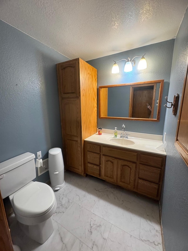 2977 State Highway 68, Marshall, MN 56258 - bathroom with a textured wall, vanity, marble finish flooring, and a textured ceiling