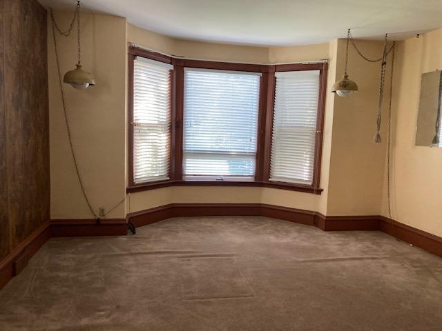 201 Cherry St, Lowry, MN 56349 - unfurnished room featuring carpet, baseboards, and electric panel