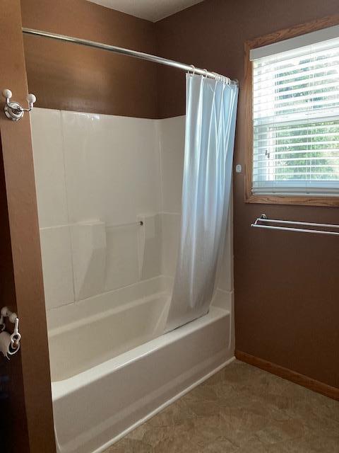 201 Cherry St, Lowry, MN 56349 - full bath with shower / bath combo and baseboards