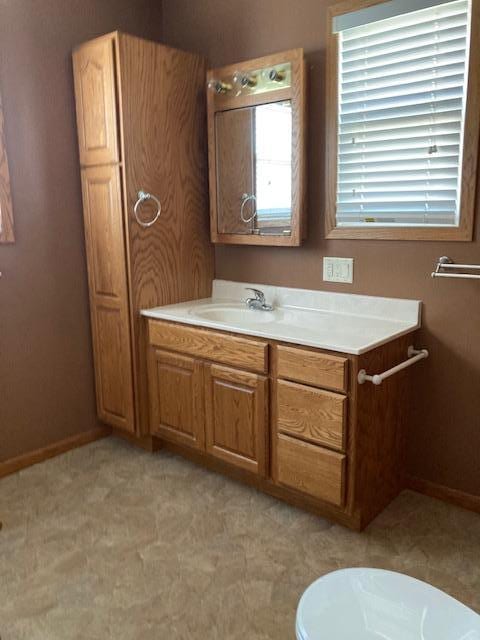 201 Cherry St, Lowry, MN 56349 - bathroom with vanity and baseboards