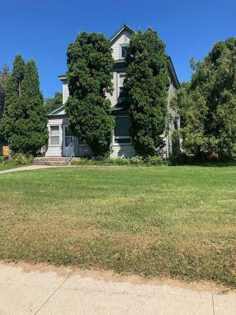 201 Cherry St, Lowry, MN 56349 - obstructed view of property with a front lawn