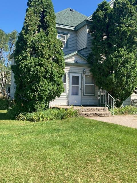 201 Cherry St, Lowry, MN 56349 - view of front of house with a front yard and a shingled roof