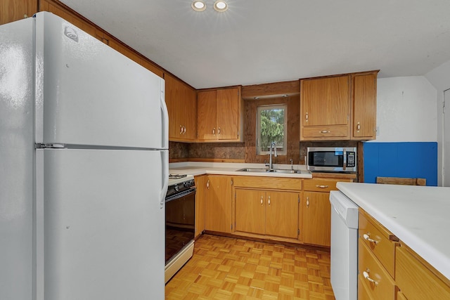505 Riverside Ave N, Sartell, MN 56377 - kitchen featuring white appliances, light countertops, and brown cabinets