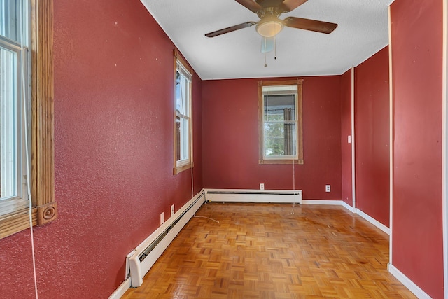 505 Riverside Ave N, Sartell, MN 56377 - spare room featuring baseboard heating, a ceiling fan, and a textured wall