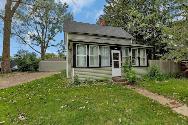 505 Riverside Ave N, Sartell, MN 56377 - bungalow-style home with roof with shingles, a chimney, and entry steps