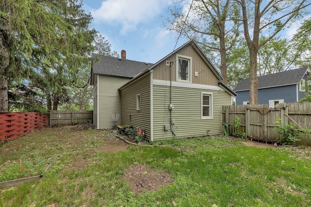 505 Riverside Ave N, Sartell, MN 56377 - back of house with a fenced backyard and a shingled roof