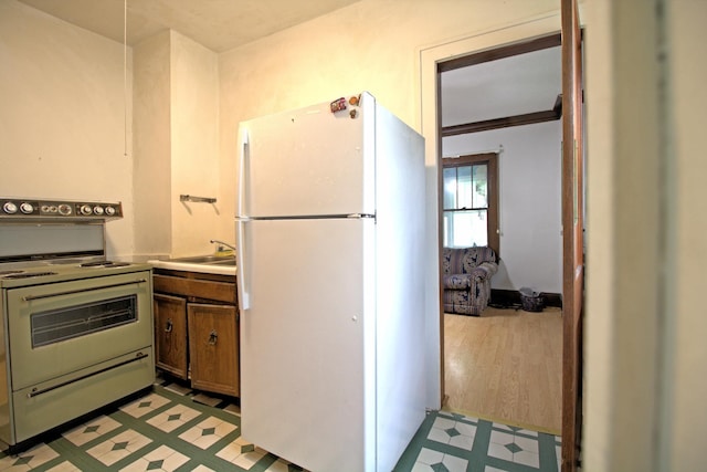 4317 2nd Ave S, Minneapolis, MN 55409 - kitchen with white appliances, light floors, and light countertops