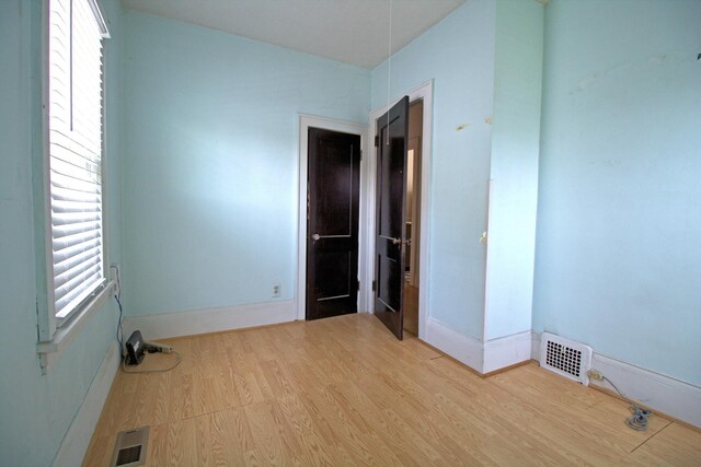 4317 2nd Ave S, Minneapolis, MN 55409 - empty room with wood finished floors and baseboards