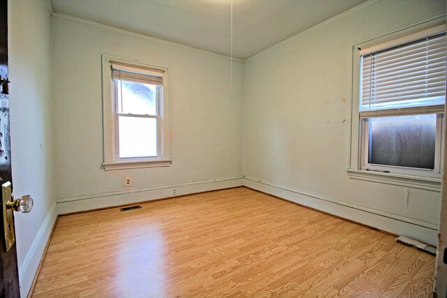 4317 2nd Ave S, Minneapolis, MN 55409 - empty room featuring ornamental molding and light wood-type flooring