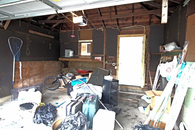 4317 2nd Ave S, Minneapolis, MN 55409 - garage featuring a garage door opener and baseboard heating