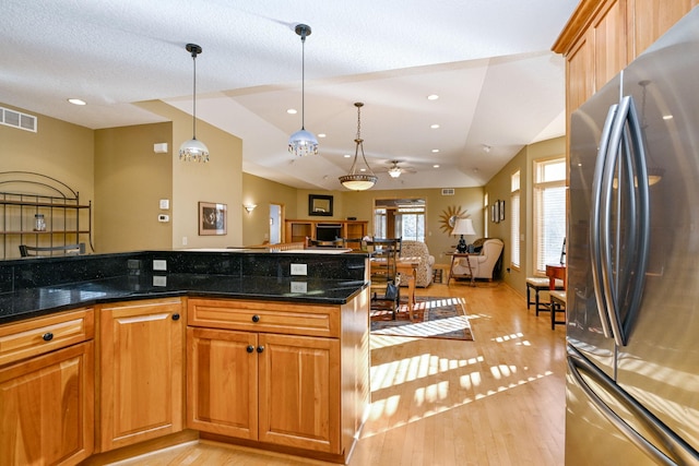 14802 Margaret Pl, Minnetonka, MN 55345 - kitchen with freestanding refrigerator, light wood-style flooring, lofted ceiling, pendant lighting, and open floor plan