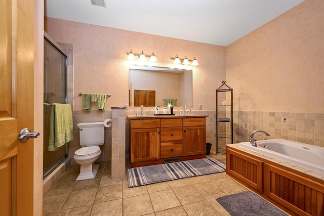 14802 Margaret Pl, Minnetonka, MN 55345 - full bathroom featuring a garden tub, tile walls, double vanity, a shower with door, and tile patterned flooring