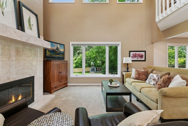 8155 134th St W, Apple Valley, MN 55124 - carpeted living room featuring a towering ceiling and a fireplace