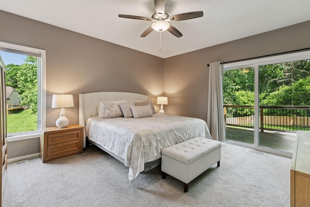 8155 134th St W, Apple Valley, MN 55124 - bedroom featuring access to exterior, carpet floors, and a ceiling fan