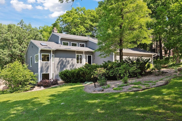 8155 134th St W, Apple Valley, MN 55124 - view of front facade with a chimney and a front yard