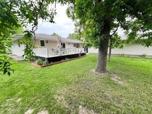 211 5th St NE, Barnesville, MN 56514 - view of grassy yard with a deck