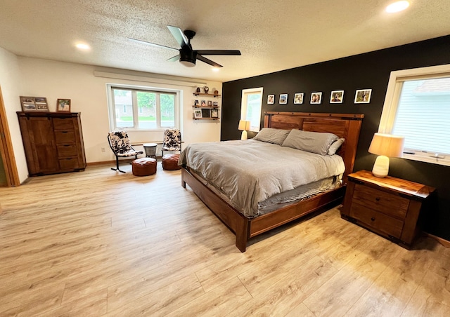 211 5th St NE, Barnesville, MN 56514 - bedroom featuring a textured ceiling, wood finished floors, ceiling fan, recessed lighting, and baseboards