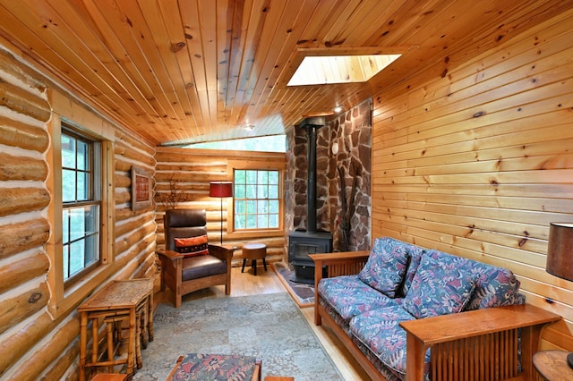 3938 State Road 77, Swiss Twp, WI 54830 - sitting room featuring rustic walls, wood ceiling, a wood stove, wood finished floors, and vaulted ceiling