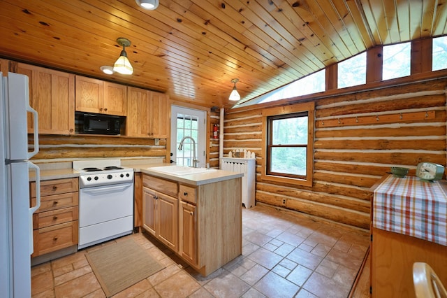 3938 State Road 77, Swiss Twp, WI 54830 - kitchen featuring white appliances, rustic walls, a peninsula, light brown cabinetry, and stone tile floors