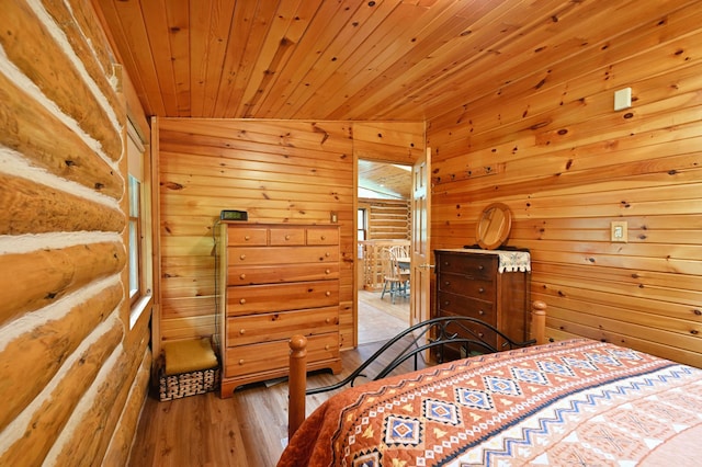3938 State Road 77, Swiss Twp, WI 54830 - bedroom featuring wood finished floors, wooden walls, and wood ceiling