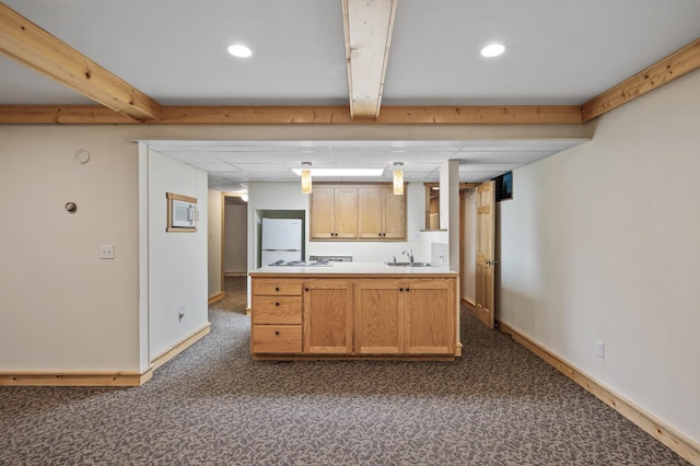 21750 Elk Lake Rd NW, Elk River, MN 55330 - kitchen with dark carpet, freestanding refrigerator, baseboards, a sink, and light countertops